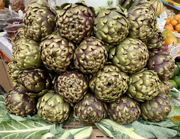 A pile of artichokes at a market