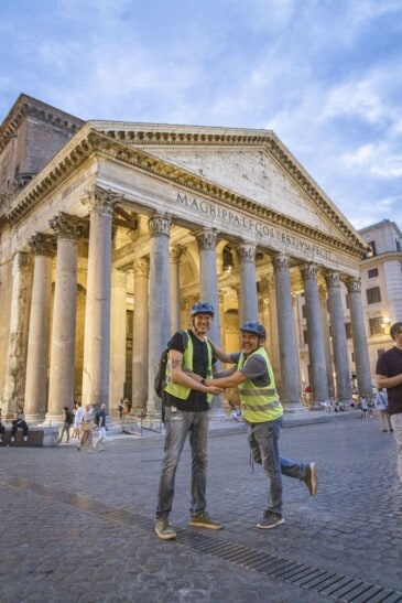 Two friends pose for a picture in front of the Pantheon in Rome, Italy