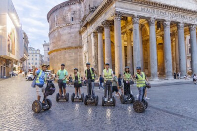 A group of Segwayers pose for a photo in front of the Pantheon in Rome, Italy