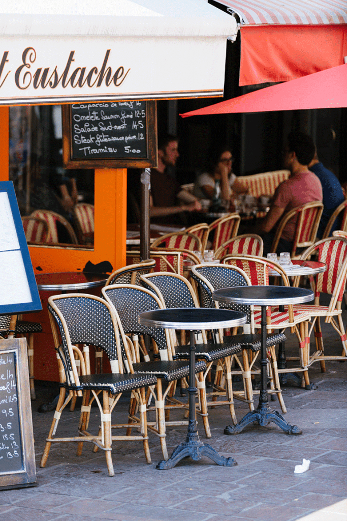 Empty chairs at a Parisian café